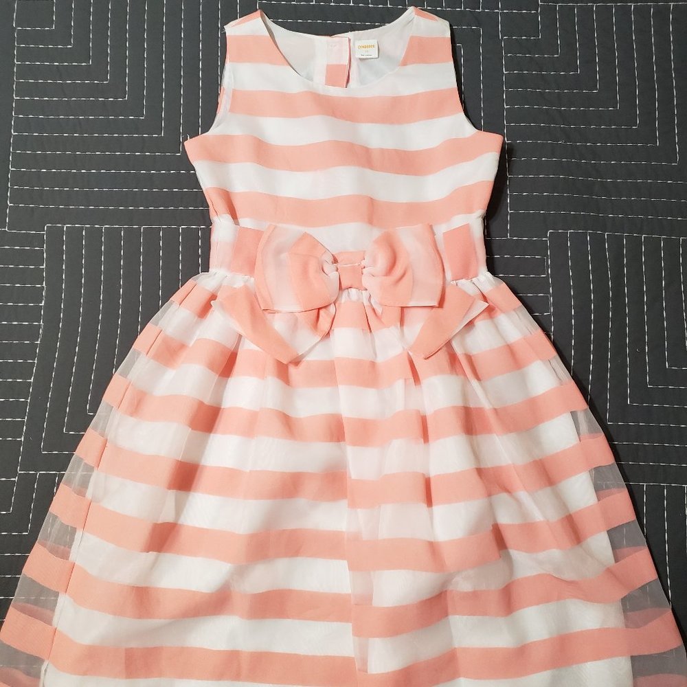 A peach colored striped dress